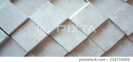 Staggered lines create a visually interesting offset tile pattern on a textured background. Staggered lines create a visually interesting offset tile pattern on a textured background. 128716006