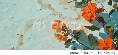 Handmade paper with floral inclusions rests on a rustic backdrop, showcasing nature. Handmade paper with floral inclusions rests on a rustic backdrop, showcasing nature. 128716024