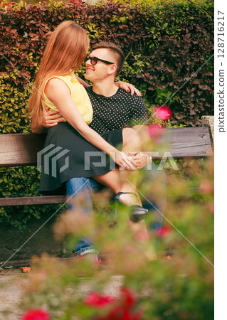 Happy couple around flowers Happy couple around flowers 128716217