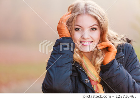 Portrait of pretty smiling woman in jacket. Portrait of pretty smiling woman in jacket. 128716463