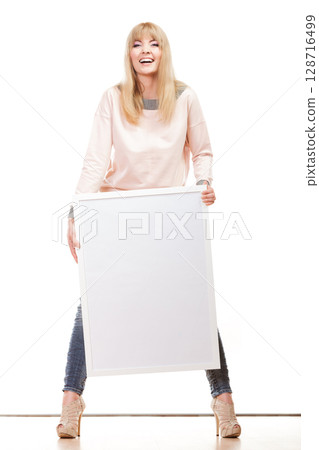 woman holding blank presentation board woman holding blank presentation board 128716499