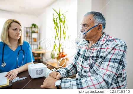 Patient gets breathing treatment in a calm clinic Patient gets breathing treatment in a calm clinic 128716540