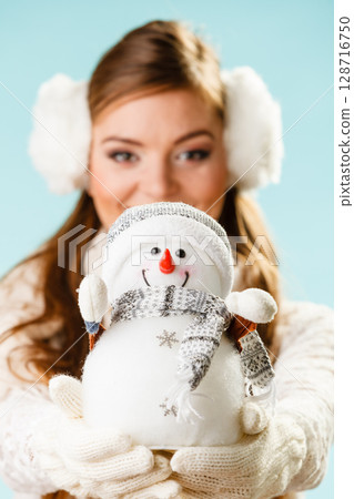 Girl with xmas snowman. Girl with xmas snowman. 128716750