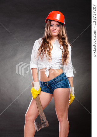 Sexy strong woman feminist with axe working. 128717207