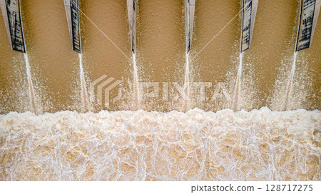 Aerial drone view of hydroelectric dam with flowing water Aerial drone view of hydroelectric dam with flowing water 128717275