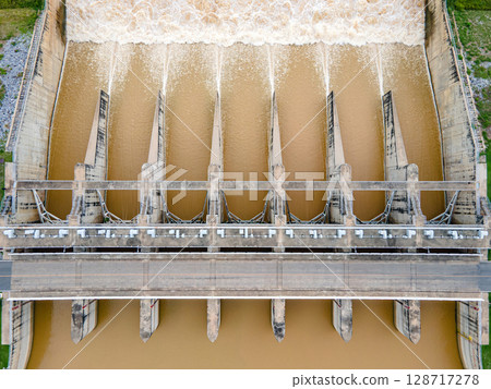 Aerial drone view of hydroelectric dam with flowing water Aerial drone view of hydroelectric dam with flowing water 128717278