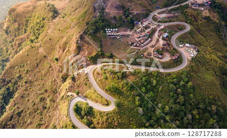 Aerial view of curvy road with hillside resorts up to Phu Tub Berk in Phetchabun, Thailand Aerial view of curvy road with hillside resorts up to Phu Tub Berk in Phetchabun, Thailand 128717288