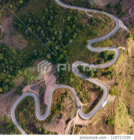 Aerial view of curvy road with hillside resorts up to Phu Tub Berk in Phetchabun, Thailand Aerial view of curvy road with hillside resorts up to Phu Tub Berk in Phetchabun, Thailand 128717290