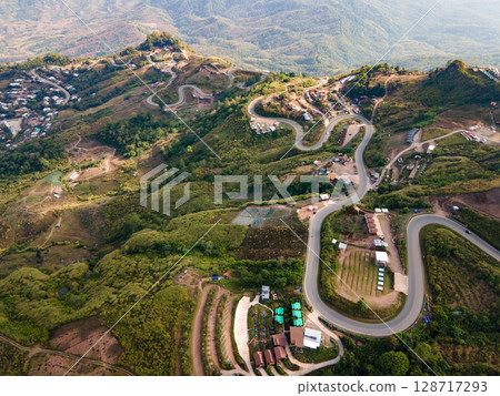 Aerial view of curvy road with hillside resorts up to Phu Tub Berk in Phetchabun, Thailand 128717293