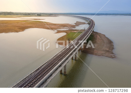Aerial view of railway track bridge at Pasak Chonlasit Dam in Lopburi, Thailand 128717298