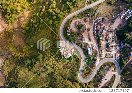 Aerial view of curvy road with hillside resorts up to Phu Tub Berk in Phetchabun, Thailand 128717307