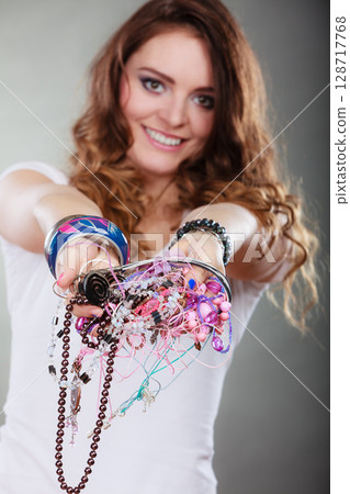Happy woman with jewelry necklaces ring bracelets 128717768