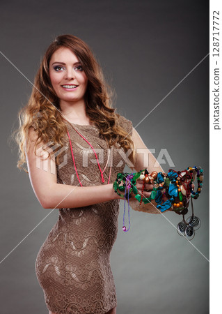 Pretty woman with jewelry necklaces beads and hat. Pretty woman with jewelry necklaces beads and hat. 128717772