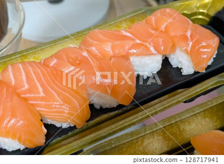 Delicious fatty salmon nigiri sushi - takeaway 128717941
