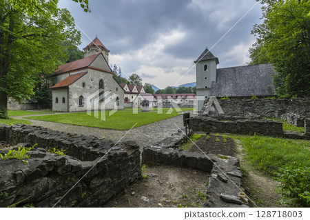 Cerveny Klastor monastery ruins with church and bell tower under cloudy sky in Slovakia Cerveny Klastor monastery ruins with church and bell tower under cloudy sky in Slovakia 128718003