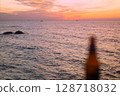 Blurred Beer Bottle on Sunset Sea Background 128718032
