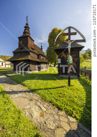 Wooden Church of Saint Michael the Archangel in Rusky Potok illuminating faith in Presovsky kraj, Slovakia Wooden Church of Saint Michael the Archangel in Rusky Potok illuminating faith in Presovsky kraj, Slovakia 128718171