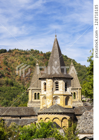 Sainte Foy Abbey Church rising above Conques village in Aveyron, France Sainte Foy Abbey Church rising above Conques village in Aveyron, France 128718185