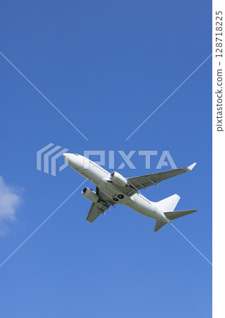 Passenger Airplane Flying Over Hostivice, Czechia 128718225