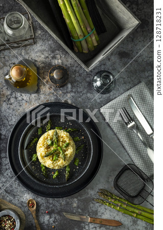Gourmet Risotto Dish with Fresh Asparagus Garnish 128718231