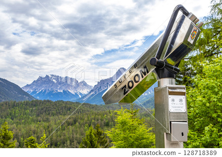 Binoculars at Zugspitze mountain alpine landscape in Alps Tyrol Austria. Binoculars at Zugspitze mountain alpine landscape in Alps Tyrol Austria. 128718389