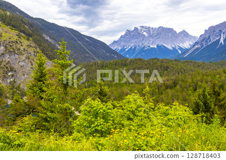 Panorama view Zugspitze mountain alpine landscape in Alps Tyrol Austria. Panorama view Zugspitze mountain alpine landscape in Alps Tyrol Austria. 128718403