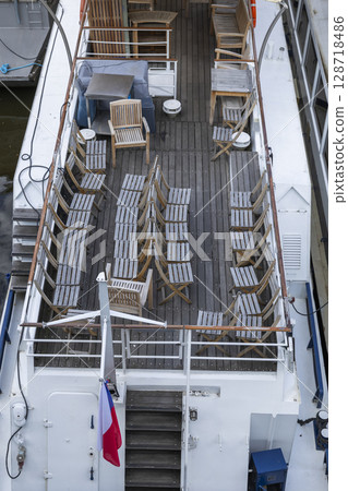 Empty Deck Chairs on a Prague Riverboat 128718486
