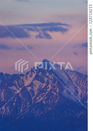 Krivan peak glowing pink and purple during sunset in High Tatras, Slovakia 128719215