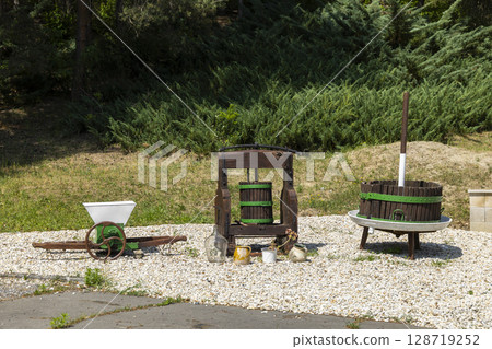 Old grape processing machines standing outdoor in Slovakia 128719252