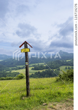 Hiking trail sign pointing towards scenic landscape in Pienap - Pieniny National park, Slovakia 128719276