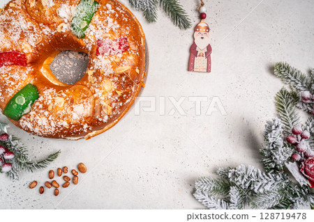 Roscon de reyes is a traditional Spanish Christmas pastry cake 128719478