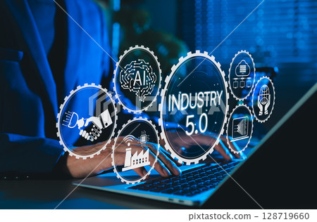 Industry 5.0 Concept. Person using laptop with Industry 5.0, AI icons, smart factory, connectivity, advanced technology integration, human machine collaboration, and future of industrial innovation. Industry 5.0 Concept. Person using laptop with Industry 5.0, AI icons, smart factory, connectivity, advanced technology integration, human machine collaboration, and future of industrial innovation. 128719660