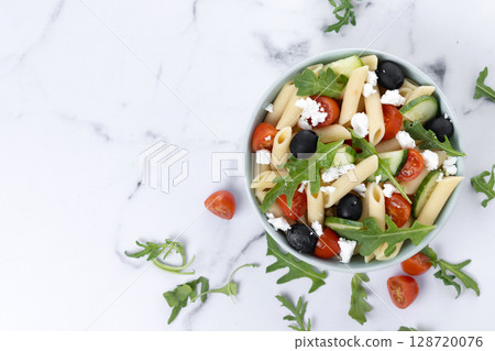 Mediterranean Pasta Salad in bowl with Fresh Vegetables and Herbs Mediterranean Pasta Salad in bowl with Fresh Vegetables and Herbs 128720076