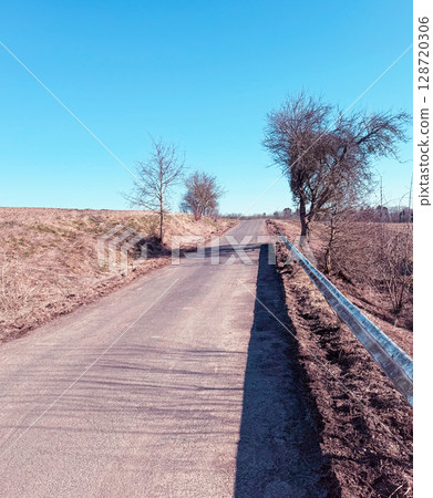 An empty rural road with morning fog An empty rural road with morning fog 128720306