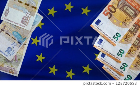 Bulgarian lev and euro banknotes displayed on EU flag. Concept of currency transition, financial integration, EU expansion, European Currency Bulgarian lev and euro banknotes displayed on EU flag. Concept of currency transition, financial integration, EU expansion, European Currency 128720658