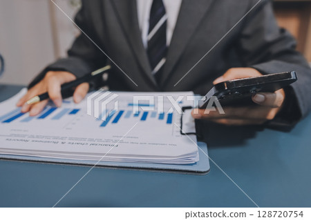Asian business man using cell phone. Having Conversation, typing sms or presenting. Asian business man using cell phone. Having Conversation, typing sms or presenting. 128720754