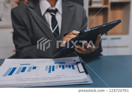 Accounting company provide finance and taxation planning for profitable cash flow, Auditor and accountant team working in office, analyze financial data and accounting record with calculator.Insight Accounting company provide finance and taxation planning for profitable cash flow, Auditor and accountant team working in office, analyze financial data and accounting record with calculator.Insight 128720761