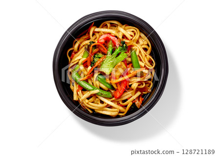 Udon noodles with vegetables in a take away bowl on white background Udon noodles with vegetables in a take away bowl on white background 128721189