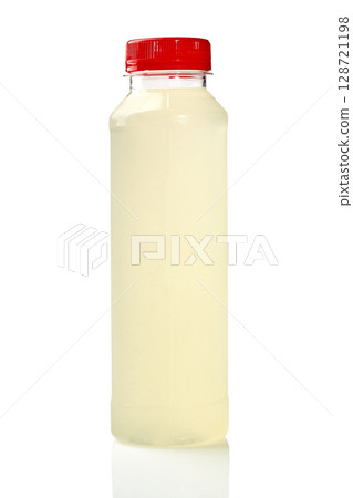 Plastic bottle of lemonade juice with red cap on white background reflecting Plastic bottle of lemonade juice with red cap on white background reflecting 128721198