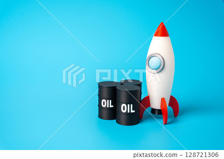Oil and rocket. Concept of sharp rise in oil price. Fuel for transport. Sudden price surges, energy market instability. Inflationary pressure, rising transportation costs. Impact of fuel prices 128721306