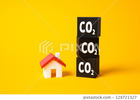 House and CO2 blocks. Greenhouse gases and households emissions. Residential emissions, environmental footprint of everyday living, home energy consumption. Sustainable housing efforts. 128721327