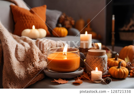 A comfortable fall oasis, where the environment is filled with the inviting fragrance of pumpkin pie and the calming flicker of lit candles. 128721338
