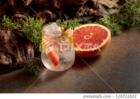 Refreshing hard seltzer with ice, grapefruit, and rosemary. Refreshing hard seltzer with ice, grapefruit, and rosemary. 128722022