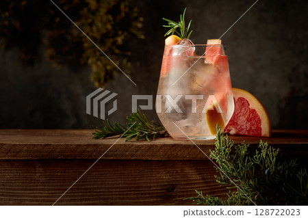 Refreshing hard seltzer with ice, grapefruit, and rosemary. Refreshing hard seltzer with ice, grapefruit, and rosemary. 128722023