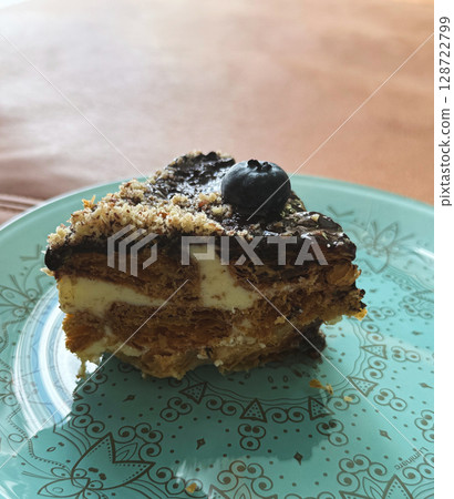 Brownies cake with almond topping, isolated on white background, side view 128722799