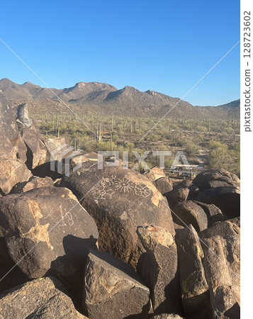 Ancient petroglyphs on rocks in Saguaro National Park, Arizona Ancient petroglyphs on rocks in Saguaro National Park, Arizona 128723602