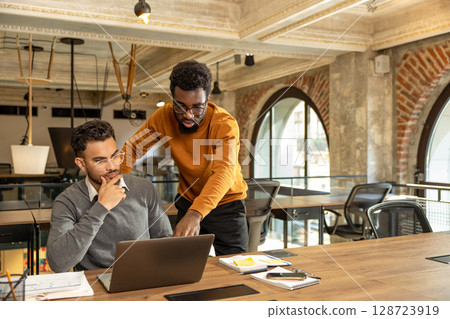 Colleagues working in the office and looking busy 128723919