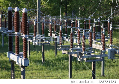 A bunch of power lines are in a field A bunch of power lines are in a field 128724123