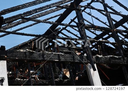 A building with a black roof and black walls 128724197