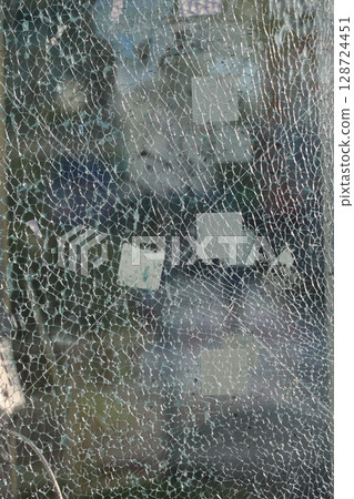A window with a lot of holes in it 128724451